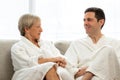 Middle aged couple in bathrobes at home. Royalty Free Stock Photo