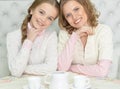 Close-up portrait of a mother and daughter drinking tea Royalty Free Stock Photo