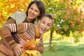 Close up portrait of mother with son hugging outoors