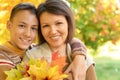 Close up portrait of mother with son hugging outoors