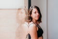 Close up portrait of muscular caucasian woman at gym standing by window. Sport and healthy lifestyle Royalty Free Stock Photo