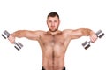 Close-up portrait of Muscular guy doing exercises with dumbbells over white background Royalty Free Stock Photo