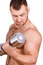 Close-up portrait of Muscular guy doing exercises with dumbbells over white background Royalty Free Stock Photo