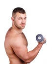 Close-up portrait of Muscular guy doing exercises with dumbbells over white background Royalty Free Stock Photo