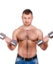 Close-up portrait of Muscular guy doing exercises with dumbbells over white background Royalty Free Stock Photo