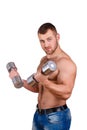 Close-up portrait of Muscular guy doing exercises with dumbbells over white background Royalty Free Stock Photo