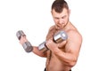 Close-up portrait of Muscular guy doing exercises with dumbbells over white background Royalty Free Stock Photo