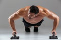 Close up portrait of a muscular strong shirtless male bodybuilder