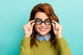 Close-up portrait of nice attractive content cheerful cheery wavy-haired girl scientist touching thick glasses learning Royalty Free Stock Photo