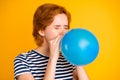 Close-up portrait of nice charming attractive girlish childish lady blowing blue baloon festal event celebratory day