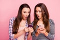 Close-up portrait of nice-looking attractive lovely cute charming amazed caucasian straight-haired girls showing sharing Royalty Free Stock Photo