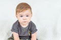 Close-up portrait of a nine-month-old baby boy over white background. Adorable red haired kid looking at camera. Copy Royalty Free Stock Photo