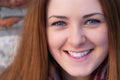 Close up portrait o a beautiful young girl with blue eyes smile