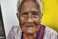 Close up portrait of an old Filipino woman with wrinkled skin