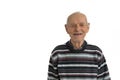 Close up portrait of an old male, man in casual clothes, senior smiles and shows his mouth without teeth, isolated over Royalty Free Stock Photo