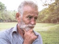 Close-up portrait of old man standing thinking in evening time, emotions and feelings Royalty Free Stock Photo