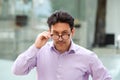 Older man with glasses looking with suspicion Royalty Free Stock Photo