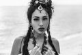 Close up portrait of oriental stylish boho girl on the beach at sunset. black and white portrait Royalty Free Stock Photo