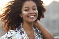 Close up portrait of overjoyed charming african american woman with curly hair