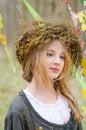 Close up portrait of a pensive girl in a folk circlet of flowe Royalty Free Stock Photo