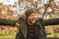 Close up portrait pensive man with wool hat laying on a bench. A Royalty Free Stock Photo