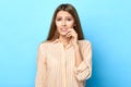 Close up portrait of a pensive worried scared young woman biting her nails Royalty Free Stock Photo