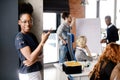 Close up portrait of pleasant black female worker recording business meeting Royalty Free Stock Photo