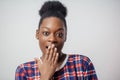 Close-up portrait of pleasant black girl letting the cat out of the bag Royalty Free Stock Photo