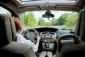 Close up portrait of pleasant looking female with glad positive expression, being satisfied with unforgettable journey by car,