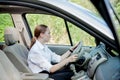 Close up portrait of pleasant looking female with glad positive expression, being satisfied with unforgettable journey by car,