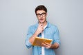 Close up portrait of pondering handsome lovely adorable cute smart clever attractive intelligent guy biting pen thinking how to so Royalty Free Stock Photo