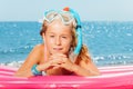 Girl in snorkeling mask having rest on the beach Royalty Free Stock Photo