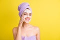 Close-up portrait of pretty cheerful girl using soap mask cleansing pore over bright yellow color background