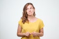 Close up portrait of pretty confident thoughtful girl, holding hand near the face, looking seriously