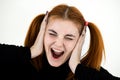 Close up portrait of pretty redhead teenage girl shouting like crazy Royalty Free Stock Photo