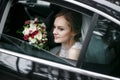 Young bride in the car