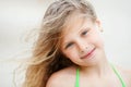 Close-up Portrait of a pretty smiling little girl with waving in Royalty Free Stock Photo