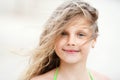 Close-up Portrait of a pretty smiling little girl with waving in Royalty Free Stock Photo