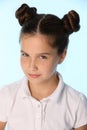 Close-up portrait of a pretty stylish brunette child girl looks in disbelief