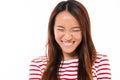Close up portrait of a pretty young asian girl laughing Royalty Free Stock Photo