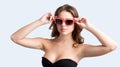 Close up portrait of pretty young woman in black stylish dress in sunglasses Royalty Free Stock Photo