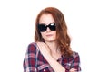 Close-up portrait of a red-haired beautiful woman wearing sunglasses Royalty Free Stock Photo