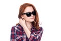 Close-up portrait of a red-haired beautiful woman wearing sunglasses Royalty Free Stock Photo