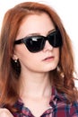 Close-up portrait of a red-haired beautiful woman wearing sunglasses Royalty Free Stock Photo