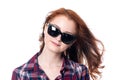 Close-up portrait of a red-haired beautiful woman wearing sunglasses Royalty Free Stock Photo