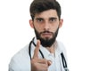 A close-up portrait of a rude, frustrated, upset doctor isolated on a white background