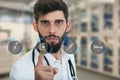 A close-up portrait of a rude, frustrated, upset doctor isolated on a white background. Medical symbols. Royalty Free Stock Photo