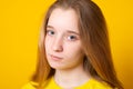 Close-up portrait of a sad girl. Studio portrait of a serious girl teenager Royalty Free Stock Photo
