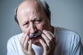 Close up portrait of sad old man face suffering from depression Royalty Free Stock Photo