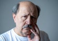 Close up portrait of sad old man face suffering from depression Royalty Free Stock Photo